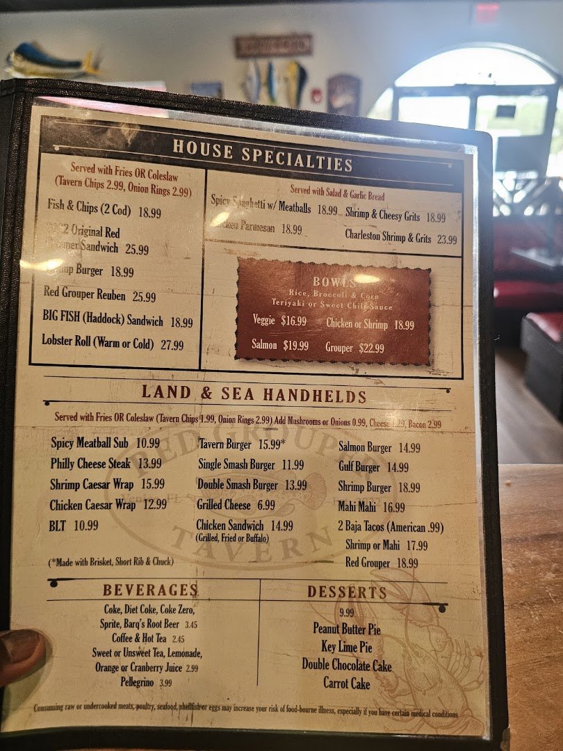 Simple restaurant interior with counter service and seating.